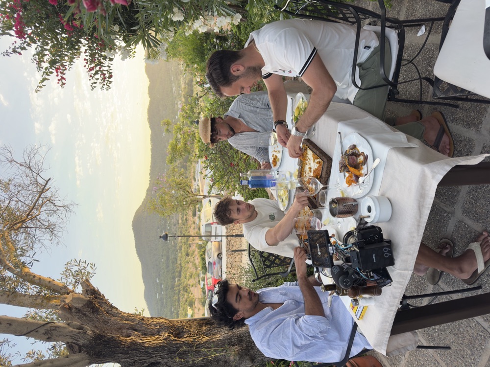 Golden-hour dinner with mountains glowing behind