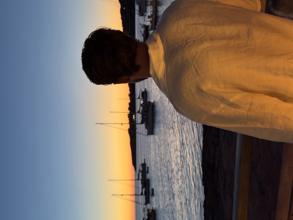 Looking out over a marina full of sailboats at dusk