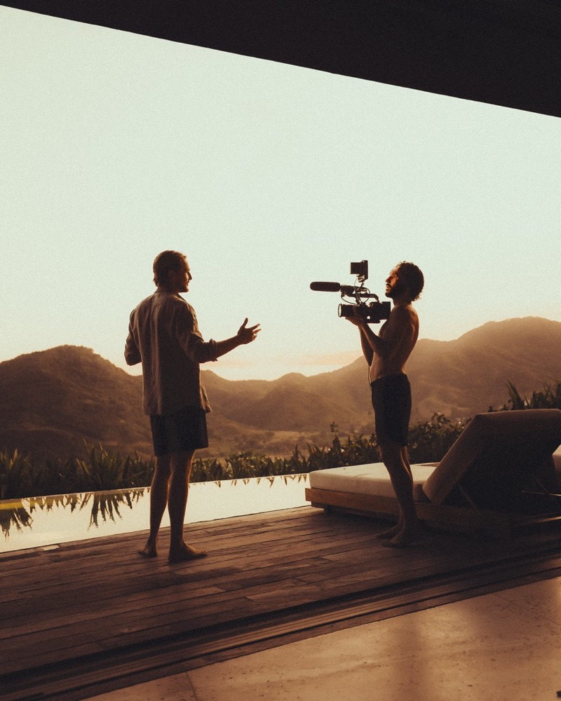 Filming on the pool deck at golden hour